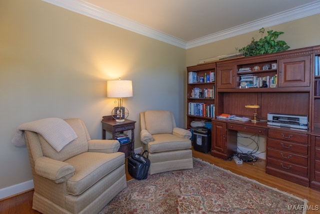 living area with wood-type flooring and ornamental molding