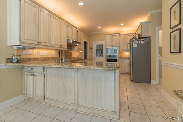 kitchen featuring light stone counters, appliances with stainless steel finishes, crown molding, and light tile patterned floors