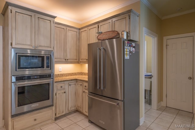 kitchen with light stone counters, light brown cabinets, light tile patterned flooring, ornamental molding, and stainless steel appliances