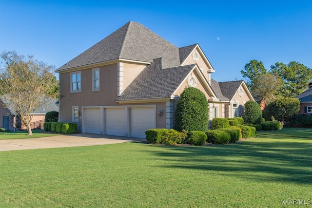 view of home's exterior featuring a garage and a yard