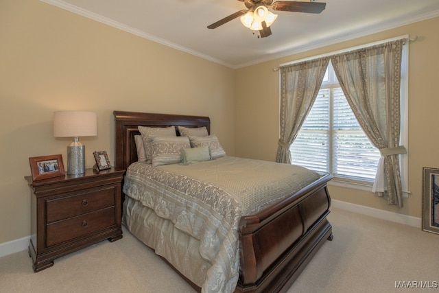 bedroom featuring crown molding, ceiling fan, and light colored carpet