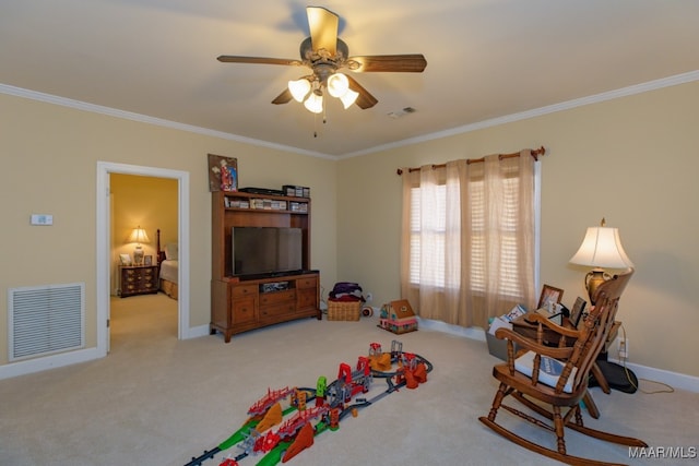 rec room featuring ceiling fan, light colored carpet, and crown molding