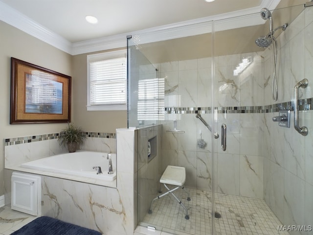 bathroom with ornamental molding and separate shower and tub