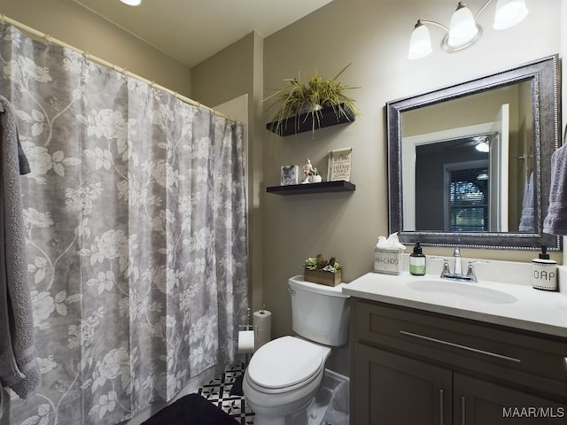 bathroom with vanity, a shower with shower curtain, toilet, and tile patterned floors