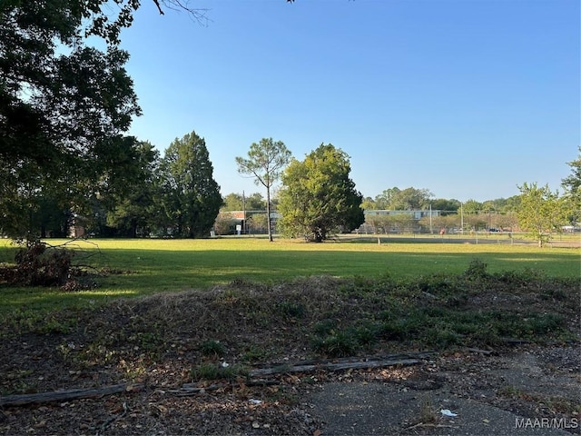 surrounding community featuring a lawn
