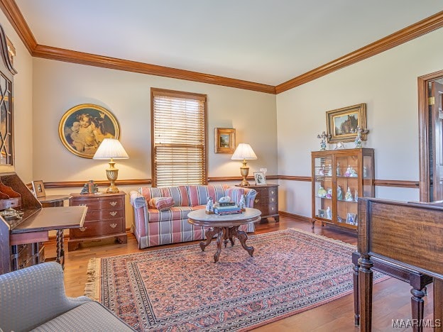 living room with ornamental molding and hardwood / wood-style floors