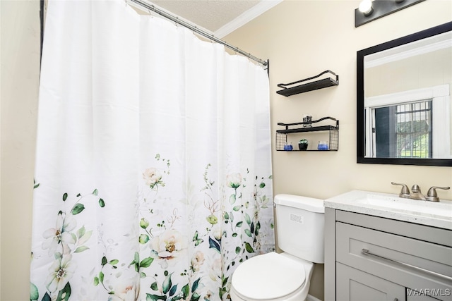 bathroom with walk in shower, toilet, ornamental molding, vanity, and a textured ceiling