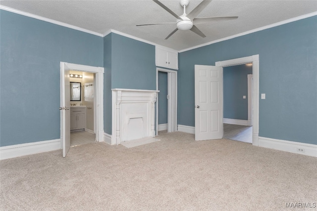 unfurnished bedroom with ceiling fan, a textured ceiling, light carpet, and ensuite bathroom