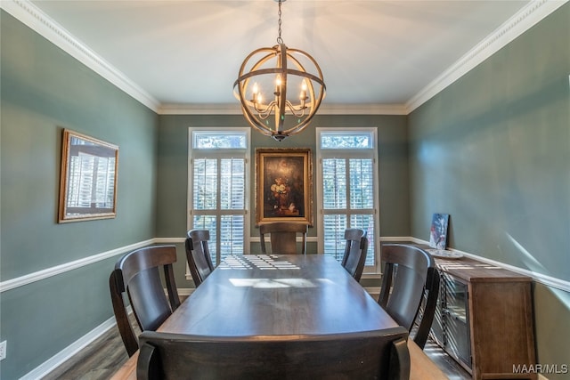 dining space with ornamental molding, wood finished floors, a wealth of natural light, and baseboards