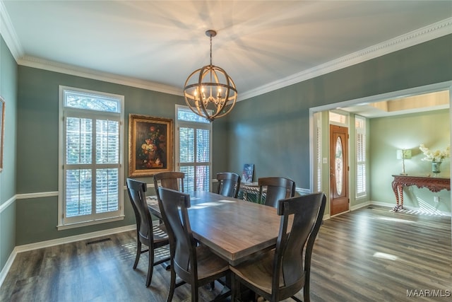 dining room featuring a notable chandelier, baseboards, dark wood finished floors, and crown molding