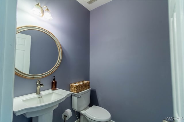 bathroom with a sink and toilet