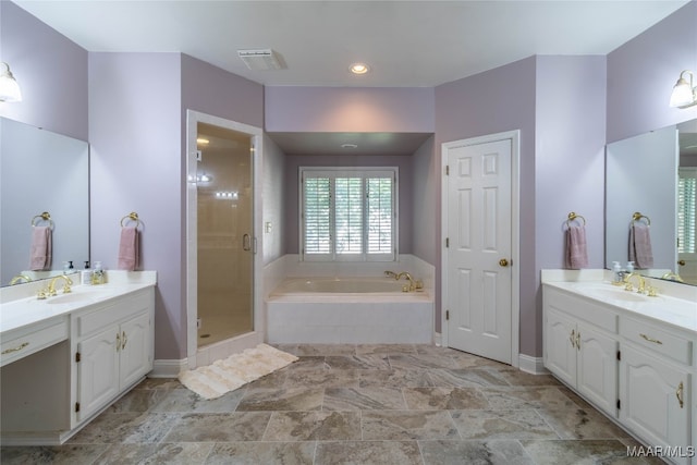 full bathroom featuring a garden tub, two vanities, visible vents, a sink, and a shower stall