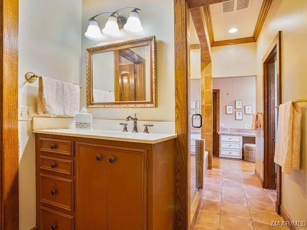 bathroom featuring ornamental molding, tile patterned floors, visible vents, and vanity