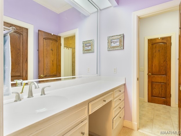 bathroom with vanity and tile patterned flooring