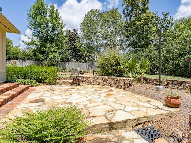 view of patio / terrace featuring fence