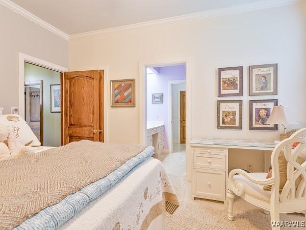 bedroom featuring light carpet and crown molding