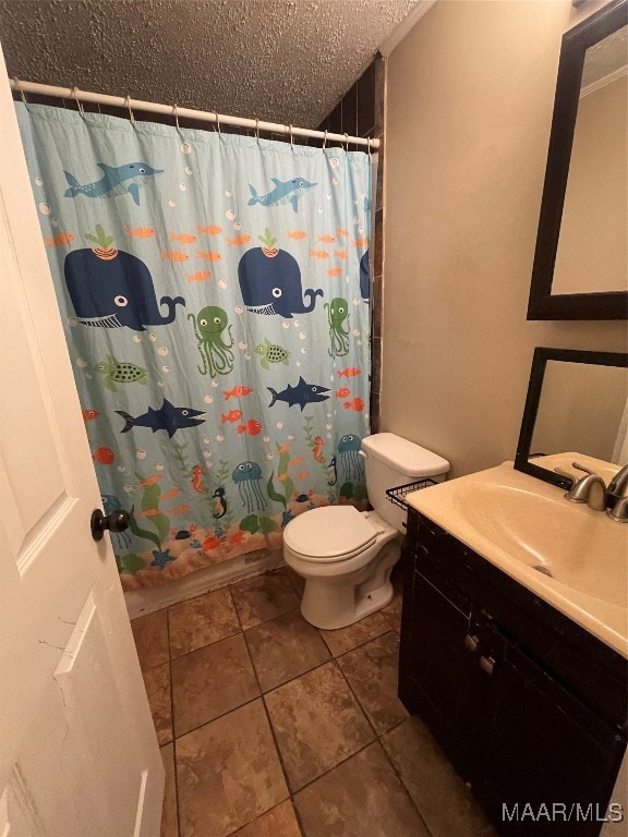 bathroom featuring a shower with curtain, vanity, toilet, and tile patterned floors