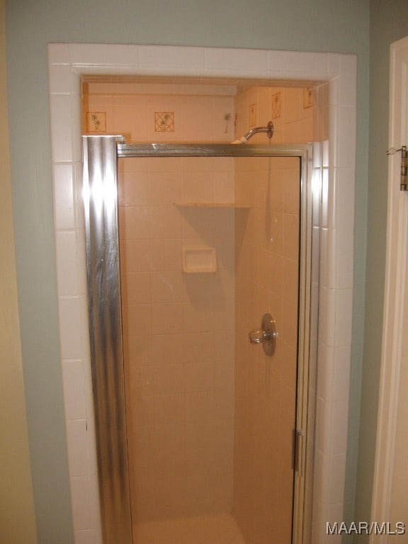 bathroom featuring an enclosed shower