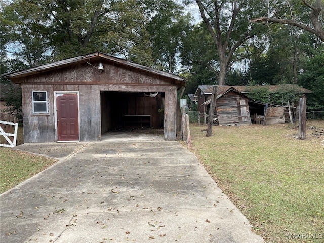 view of outbuilding featuring a yard