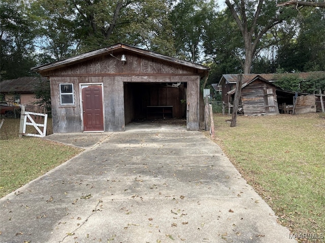 view of outbuilding featuring a lawn