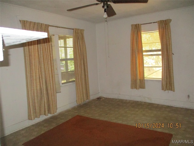 carpeted empty room with ceiling fan