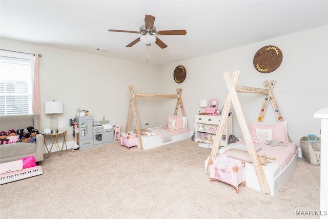 carpeted bedroom with ceiling fan