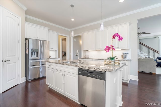 kitchen with an island with sink, sink, dark hardwood / wood-style flooring, white cabinetry, and appliances with stainless steel finishes