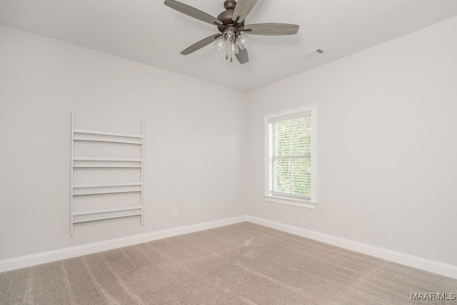 unfurnished room featuring ceiling fan and carpet flooring