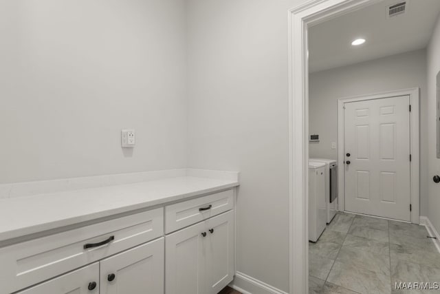 washroom with washer and clothes dryer