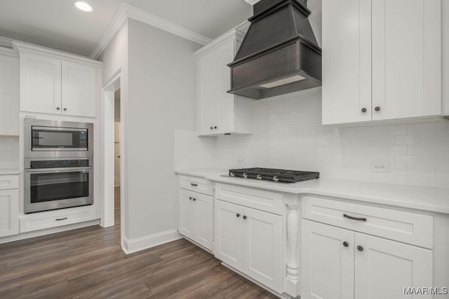78 Hillston Dr, Wetumpka, AL 36093 - kitchen with stainless steel appliances, premium range hood, ornamental molding, white cabinetry, and light countertops