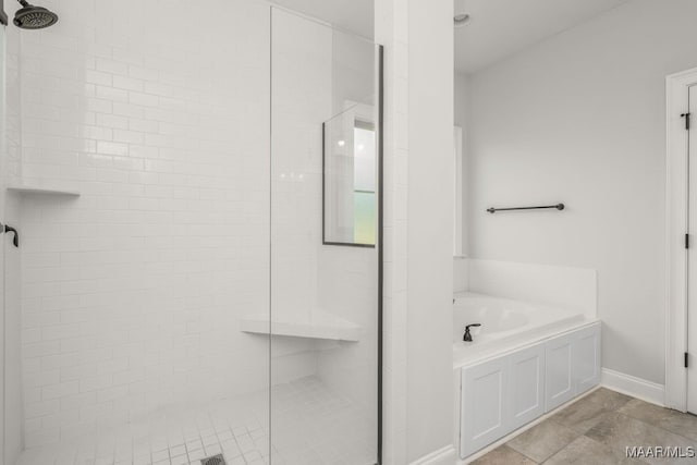 bathroom featuring tile patterned flooring and plus walk in shower