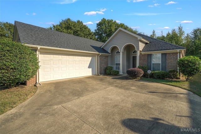 single story home featuring a garage