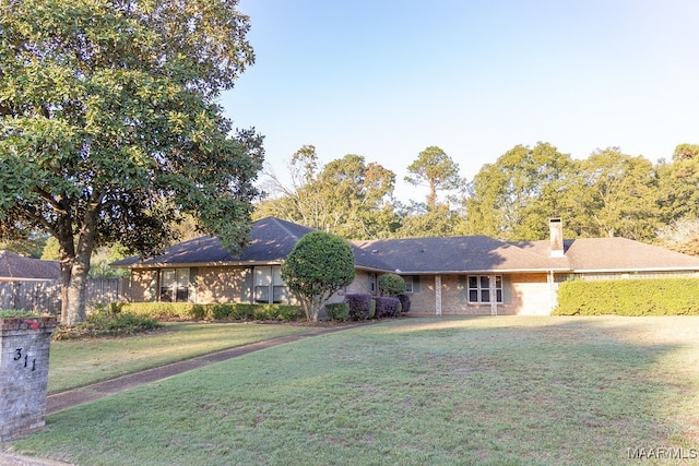 ranch-style house with a front yard