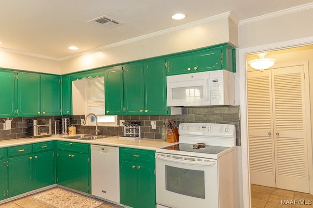 kitchen with light tile patterned floors, ornamental molding, sink, white appliances, and green cabinetry