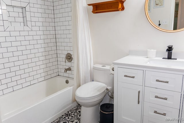 full bathroom featuring vanity, shower / bath combo with shower curtain, and toilet