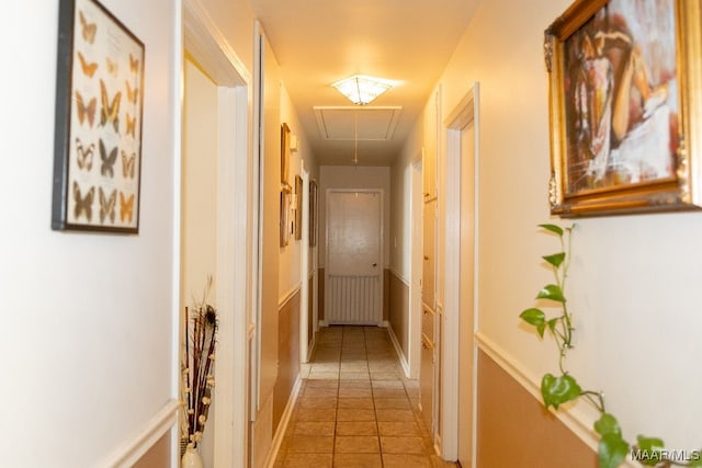 corridor featuring light tile patterned floors