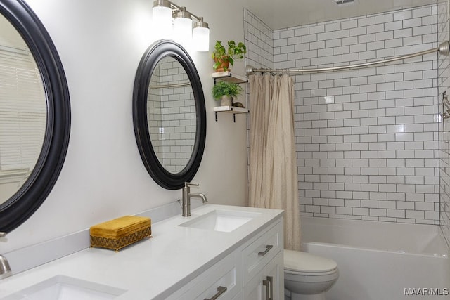 full bathroom featuring shower / bath combination with curtain, vanity, and toilet