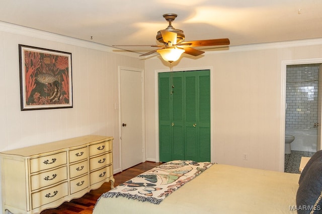 bedroom featuring ceiling fan, a closet, dark hardwood / wood-style flooring, ensuite bath, and ornamental molding