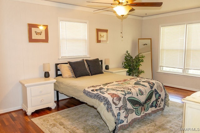 bedroom with crown molding, ceiling fan, and wood-type flooring