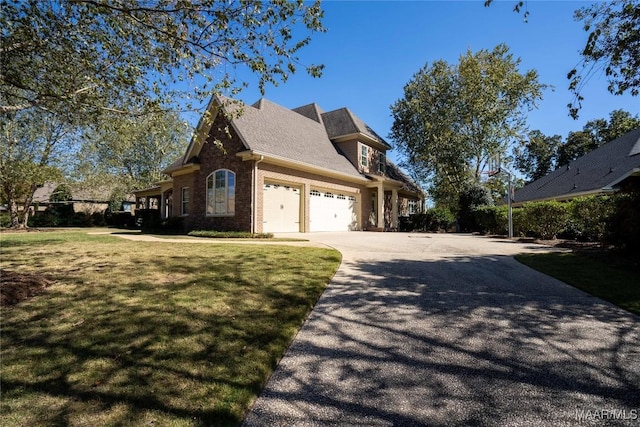 156 Walnut Point Dr, Wetumpka, AL 36093 - view of home's exterior with a garage, brick siding, concrete driveway, and a lawn