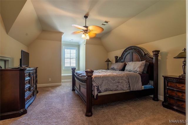 carpeted bedroom with vaulted ceiling and ceiling fan