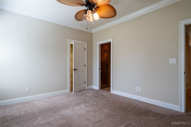 carpeted empty room featuring crown molding and ceiling fan