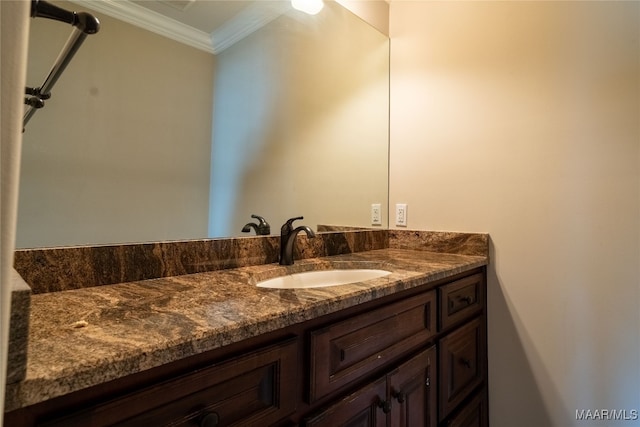 bathroom with vanity and ornamental molding