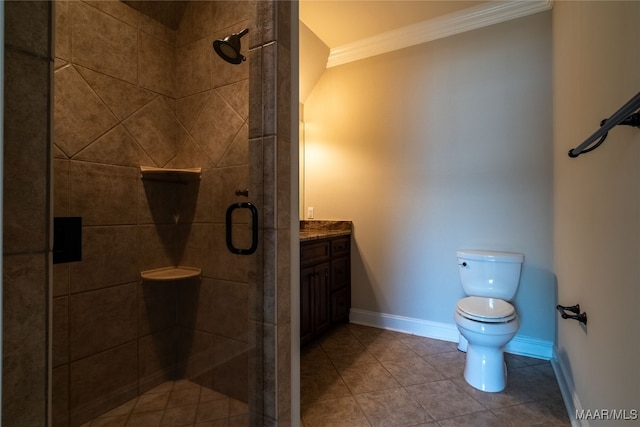 bathroom featuring toilet, ornamental molding, vanity, an enclosed shower, and tile patterned floors