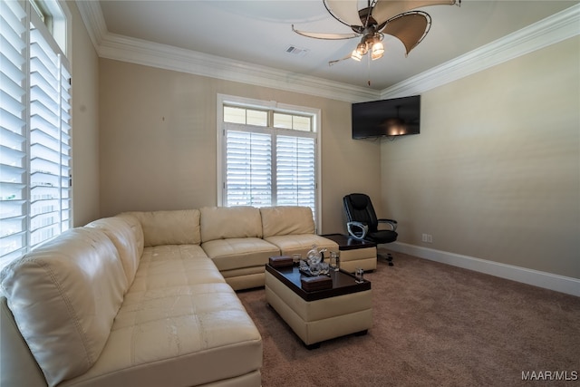 living room featuring ornamental molding, ceiling fan, and carpet floors