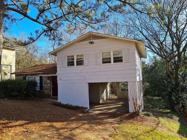 view of property exterior with a carport