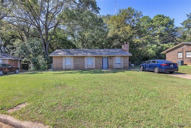 exterior space with a yard and central air condition unit