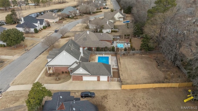 birds eye view of property with a residential view