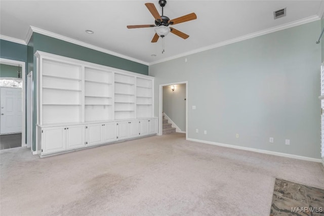 interior space featuring visible vents, light carpet, baseboards, and stairs