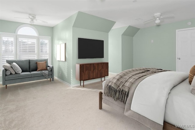 bedroom with carpet floors, lofted ceiling, ceiling fan, and baseboards